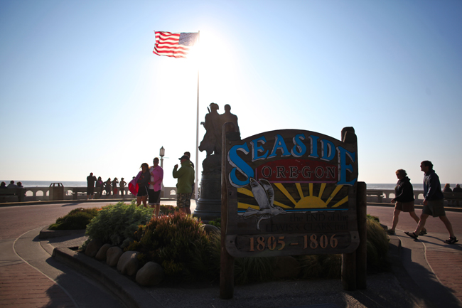 The Seaside Oregon sign. It's a wooden sign with red, blue, and yellow. The sign is fun and playful, like Seaside, Oregon.
