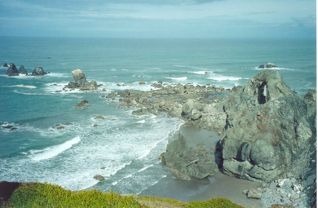 Blacklock Point. Photo by OCVA via Flickr CC2. Blue ocean and gray cliffs at Blacklock Point.