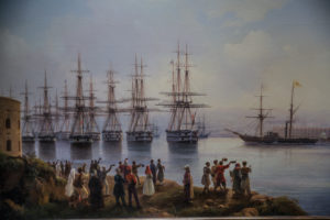 People waving at ships
