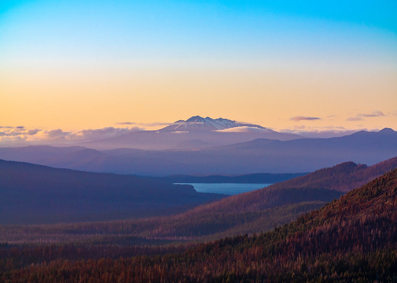 Diamond Lake from several miles away with a mountain in the background.