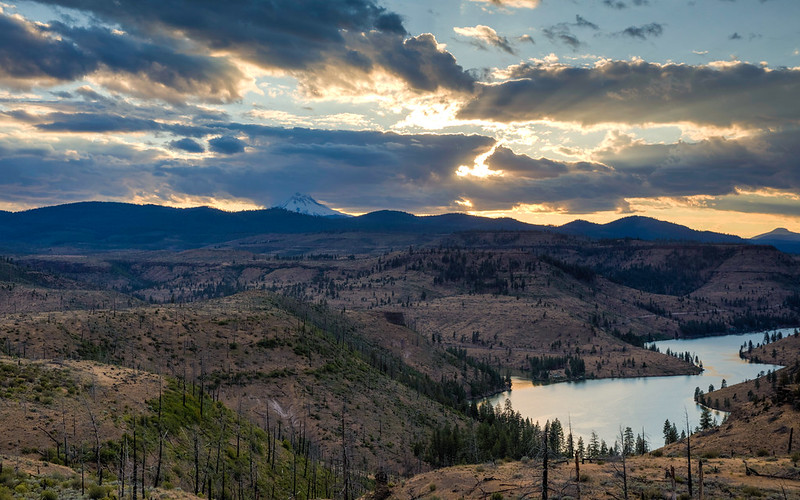 Lake Billy Chinook from above at sunset. A snowcapped peak can be seen in the distance, but is not visible from the lakeshore.