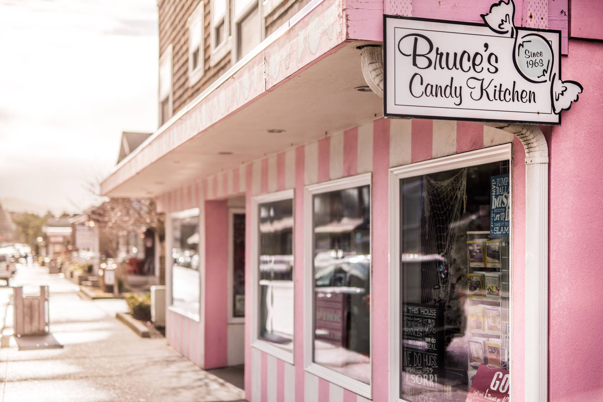 Photo via Bruce’s Candy Kitchen Facebook page. The pink and white striped exterior of Bruce's Candy Kitchen in Cannon Beach Oregon.
