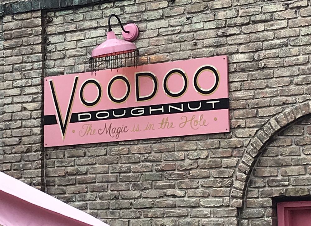 featured, ohoto by Karen H. Yelp Voodoo Doughnut's sign