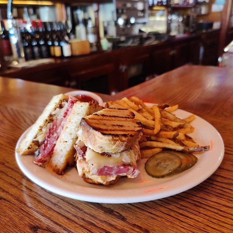 A grilled meat sandwich and fries at Cassidy's Restaurant And Bar in Portland, Oregon.