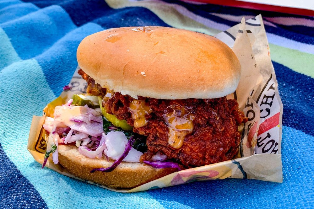 A chicken slider on a bun with slaw and pickles at Dave's Hot Chicken. Looks pretty tasty.
