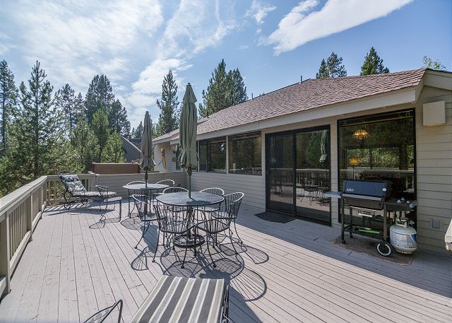 The exterior of Hickory #20. It's a gray two story building with a large wooden back deck.