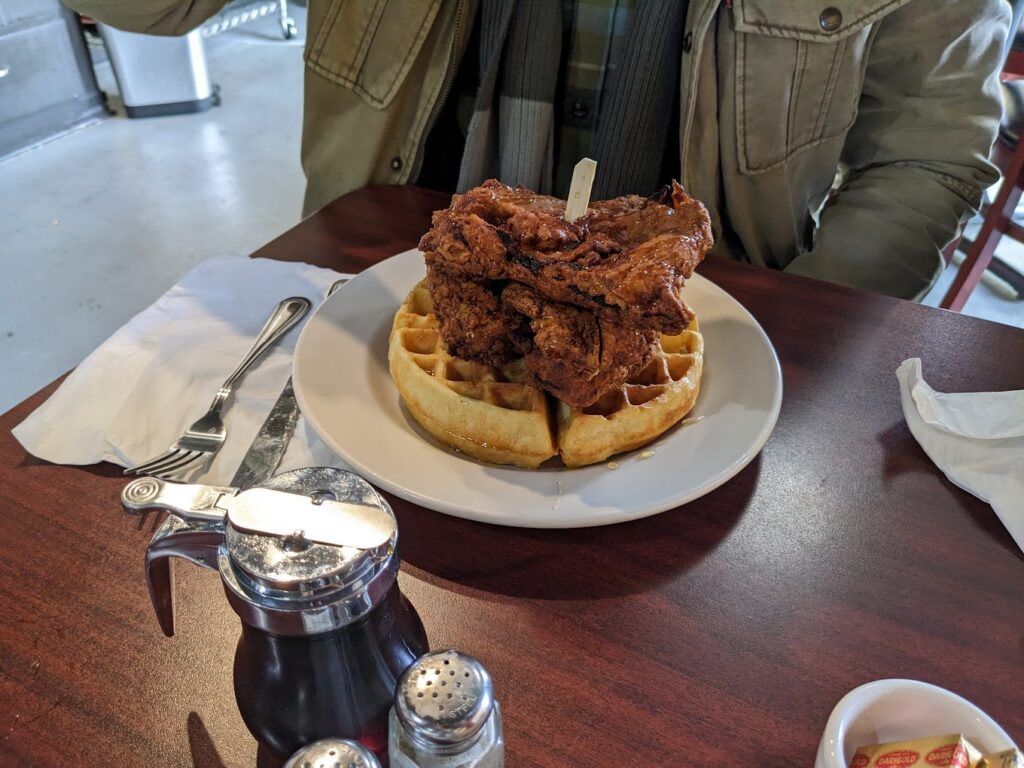 Fried chicken on top of a waffle.