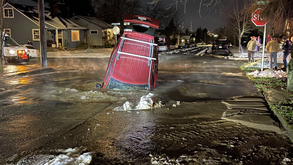 vehicle plunging into sinkhole