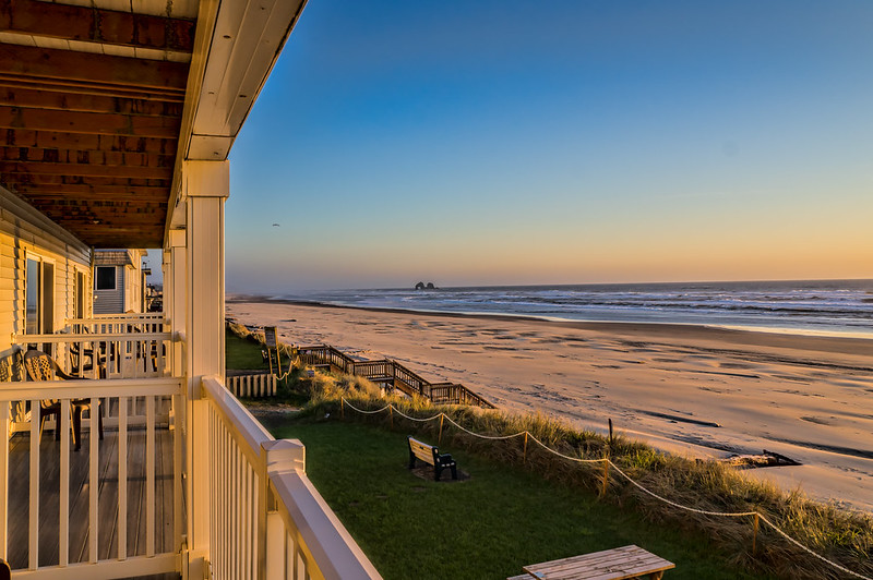 Rockaway beach as viewed from the balcony of a hotel above the beach.