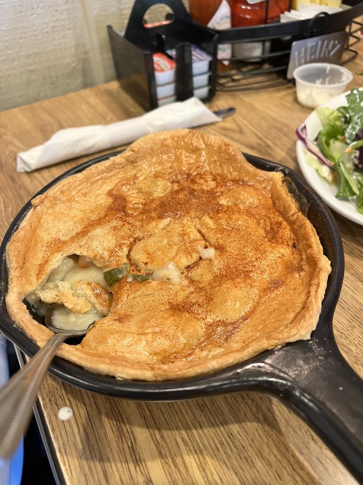 Chicken pot pie in a black skillet.