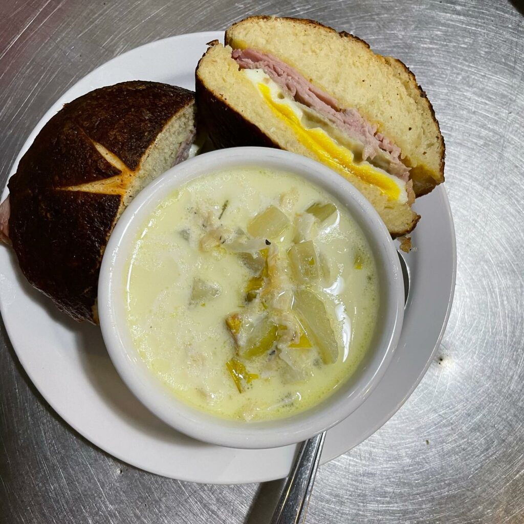Clam chowder and a ham breakfast sandwich.