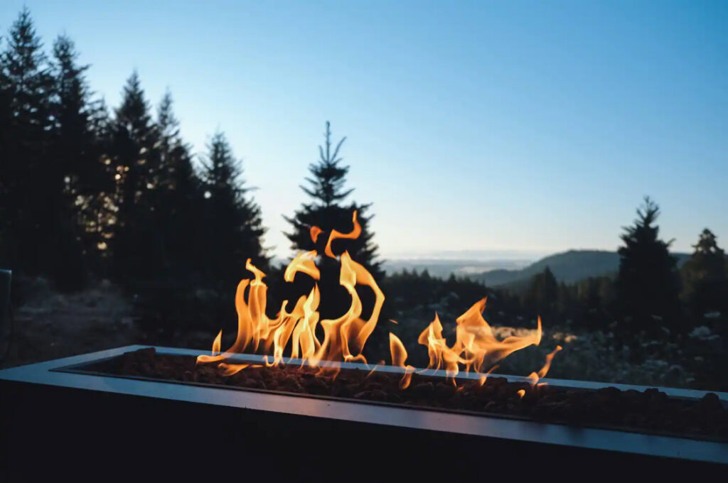 Fire in the fire pit at sunset.