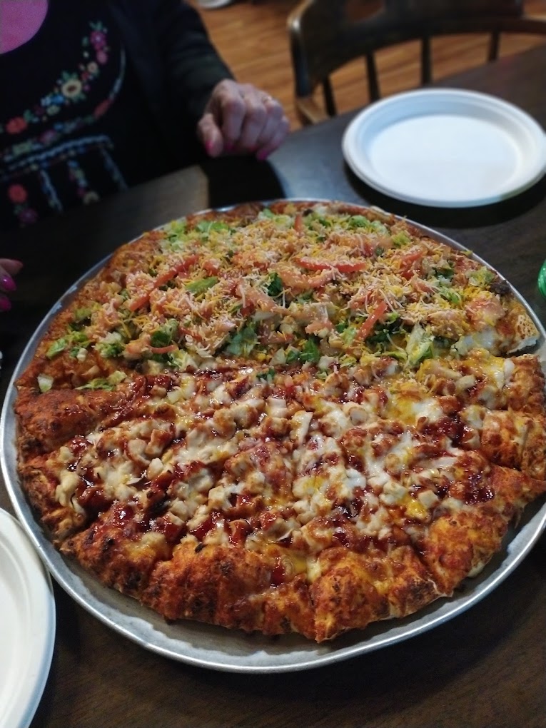 A delicious looking pizza with lots of toppings.