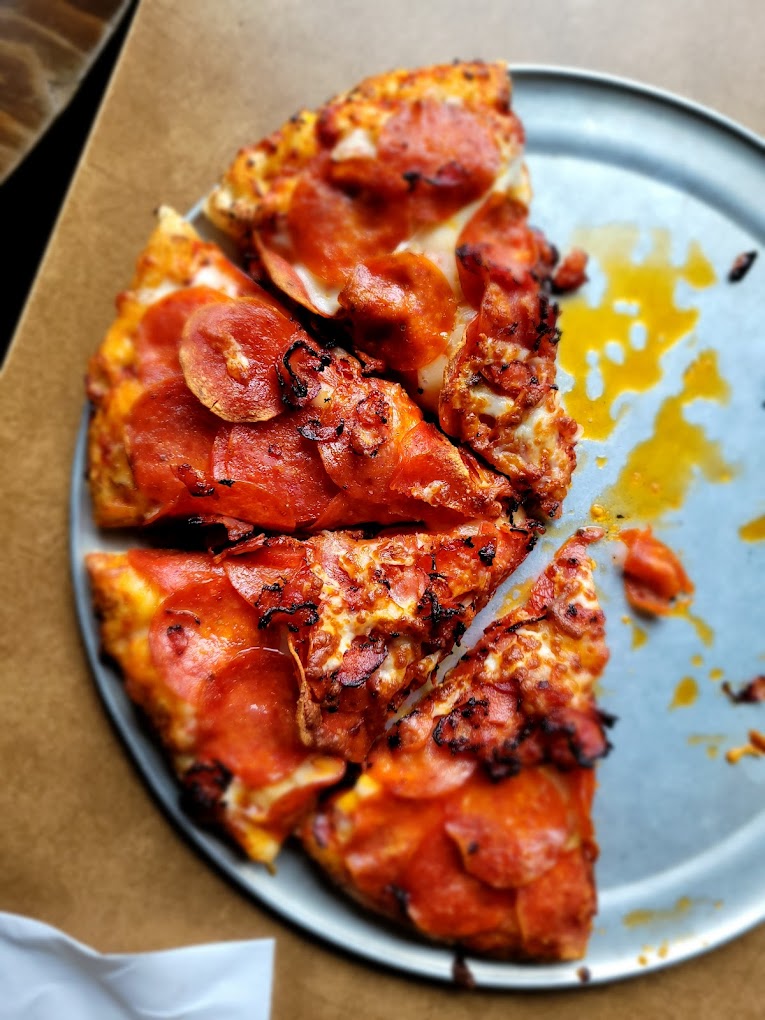 A delicious looking pizza with lots of toppings.