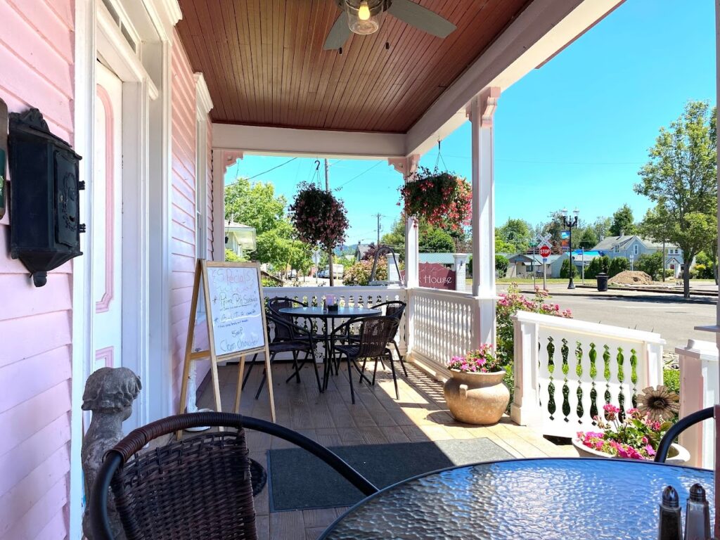 The covered porch of the Pink House Cafe.