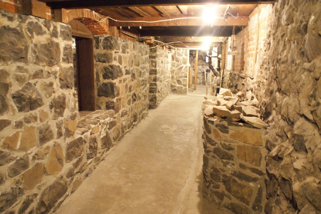 A long brick tunnel under ground.