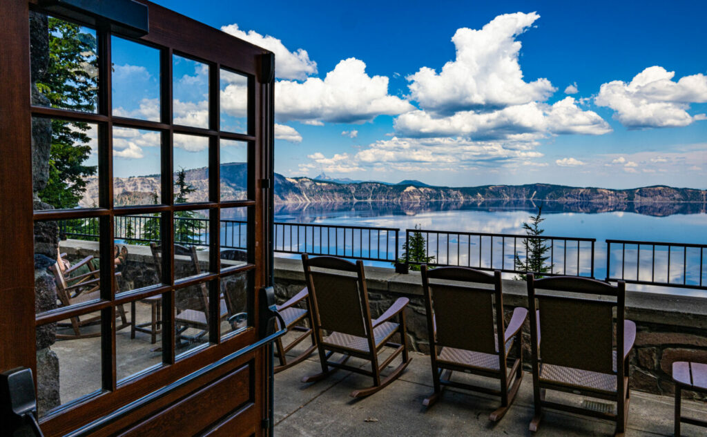 Chairs lined up on the deck at Crater Lake Lodge overlooking the lake.