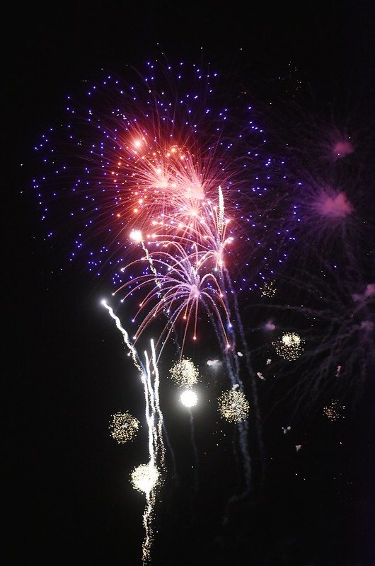 Colorful red, white and blue fireworks in the night sky over Haines, Oregon.