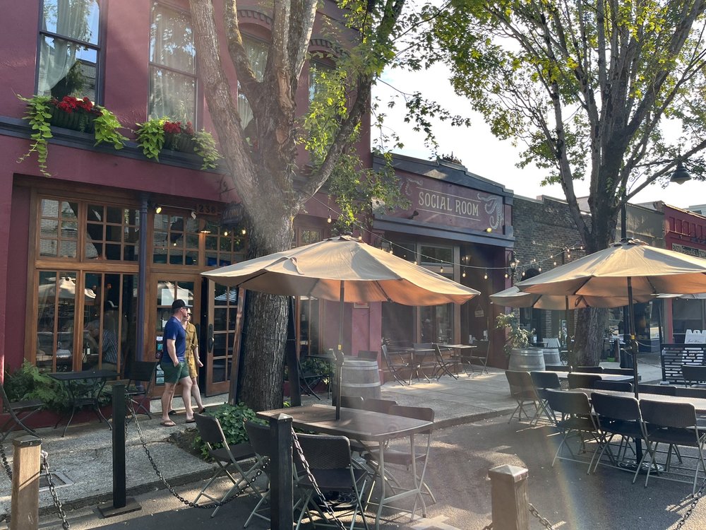 Photo by Te-see B. via Yelp. The outside of La Rambla. It's a pretty red brick building with red and dark blue accents.