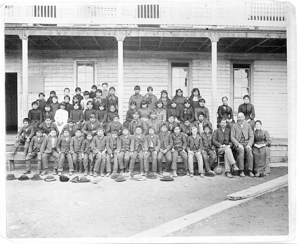 Students and staff stand in front of the Warm Springs Indian Training School, 1890. Oreg. Hist. Soc. Research Lib., bb003865 Students and staff stand in front of the Warm Springs Indian Training School, 1890.