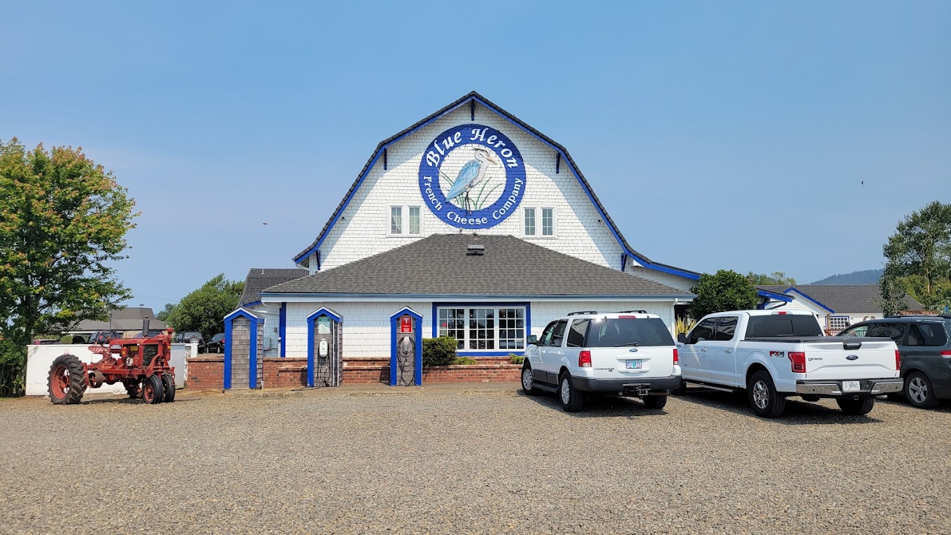 Photo by Matthew Burns via Google Local The exterior of the Blue Heron building. It's a large white building with a black roof and blue accents.