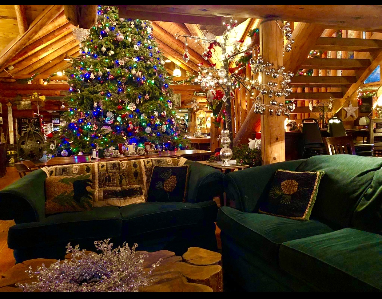 Photo by Laureen Holmgren via Google Local. A massive Christmas tree covered in ornaments and lights.
