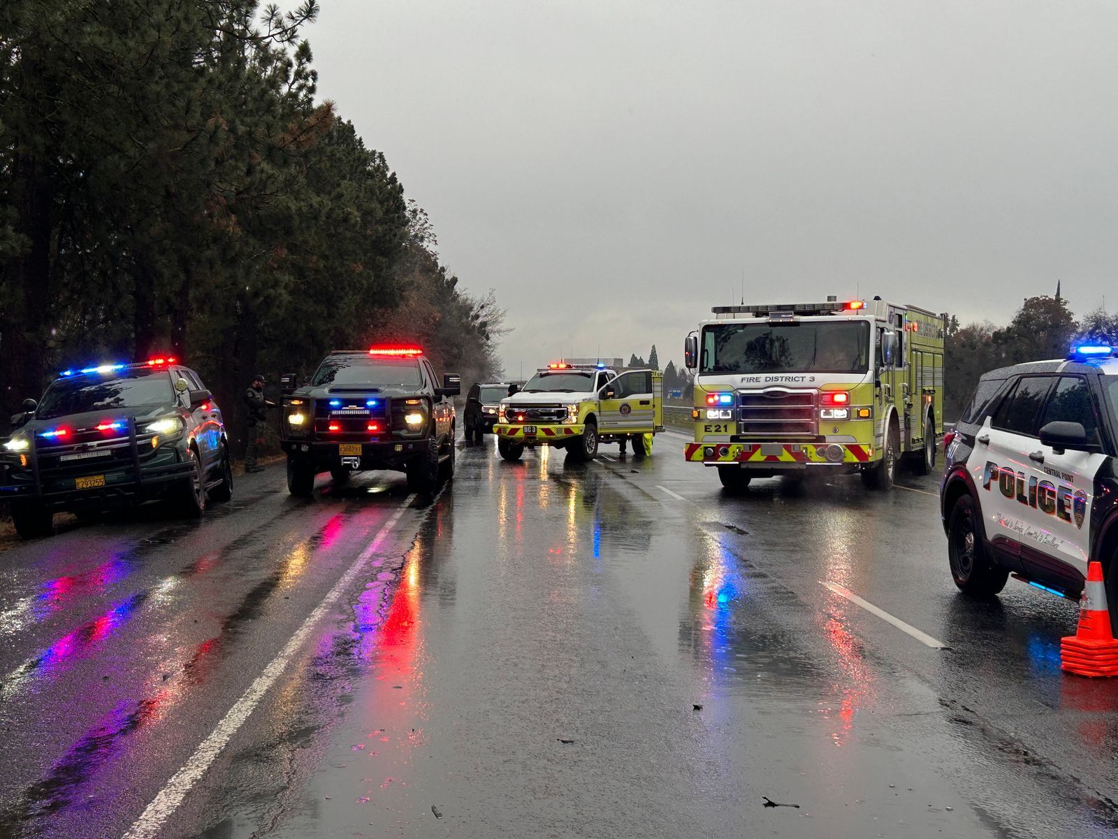 Photo via the Jackson County Sherrif’s Office. Police cars and fire trucks respond to a motorcycle accident on a rainy day on I-5 near Central Point Oregon on December 13th, 2024.