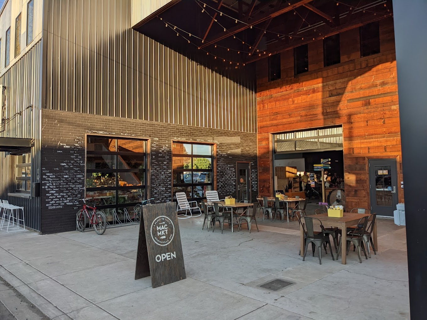 Photo by Nebojsa Jovic via Google Local. One of the outdoor seating spaces at Mac Market.