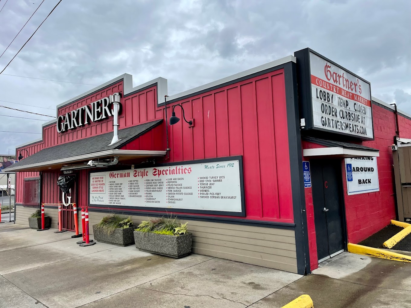 Gartner’s Meat Market in Portland, Oregon. Photo by Ryan E. via Google Local. The outside of Gartner's Meats. It's a red building with a white sign out front listing the wide variety of meats that they sell.