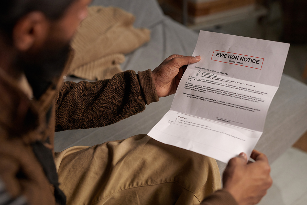 Person,Holding,Eviction,Notice,While,Sitting,On,Couch,And,Reading eviction notice portland