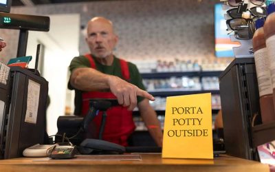 Man’s Dignity Evaporates As Clerk Silently Points to Sign Reading ‘Porta Potty Outside’