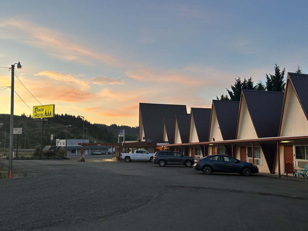 The Ranch Motel. Photo by Kerri H. via Yelp. The Ranch Motel at sunset. Cars are parked in the parking lot, and the A-frame cabins are all lined up. It's a cute retro hotel on the outside.