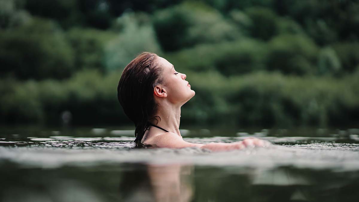 Beautiful,Woman,Swims,In,The,Water,Of,A,Lake,River, hot springs woman