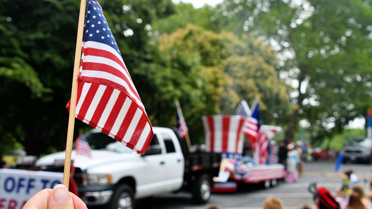 Waving,An,American,Flag,At,The,Independence,Day,Parade,On waving american flag