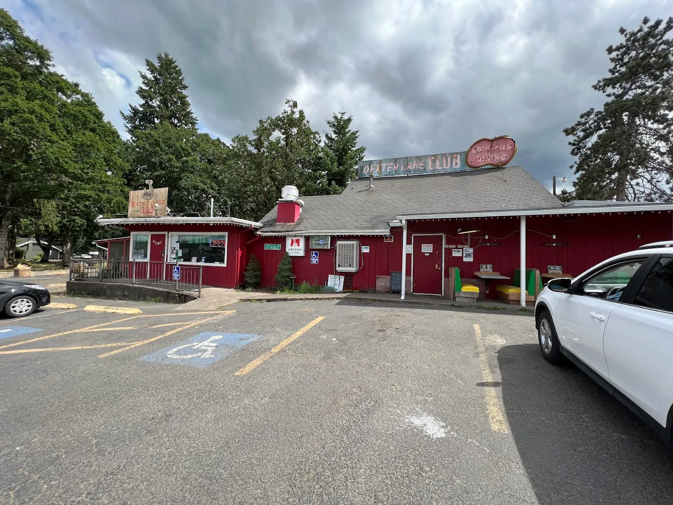 Photo by Styx Allum via Google Local. The outside of Rattlesnake BBQ at the Dexter Lake Club.
