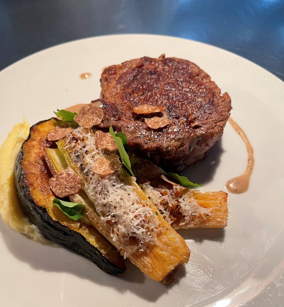 14 oz Prime Delmonico - Acorn Squash, Parsnip-Potato Puree, Leek Au Gratin, Smoked Bone Marrow Sauce and Fresh Oregon White Truffle.