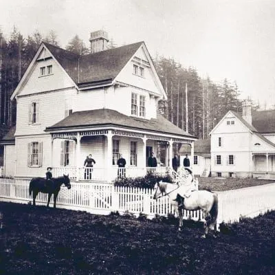 A black and white photo of the two light keeper's cottages.