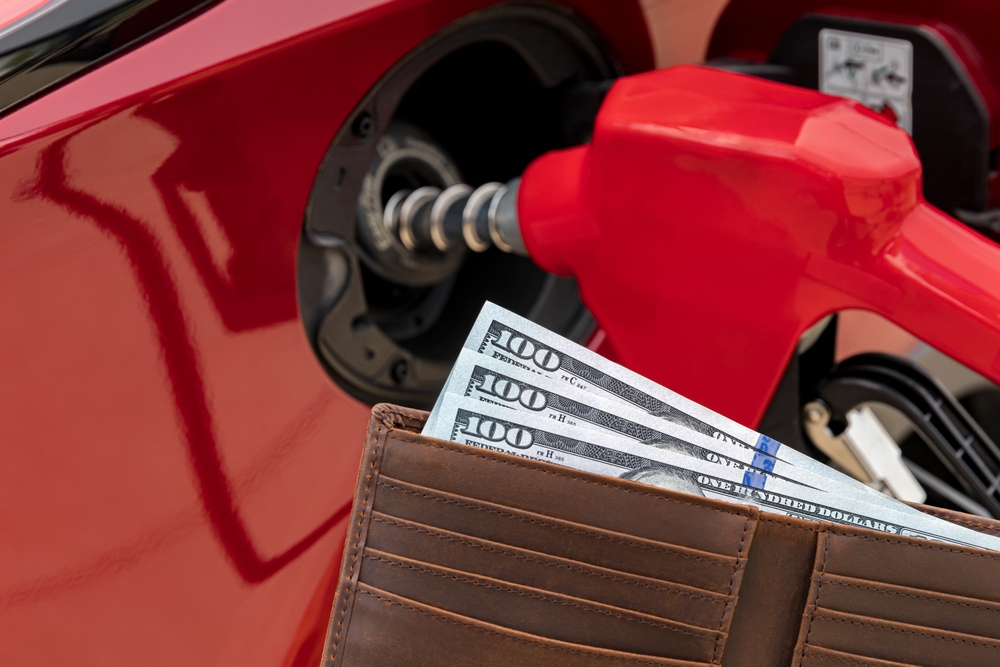 Fueling,Car,At,Gas,Station,With,Cash,Money,In,Wallet. Oregon gas tax