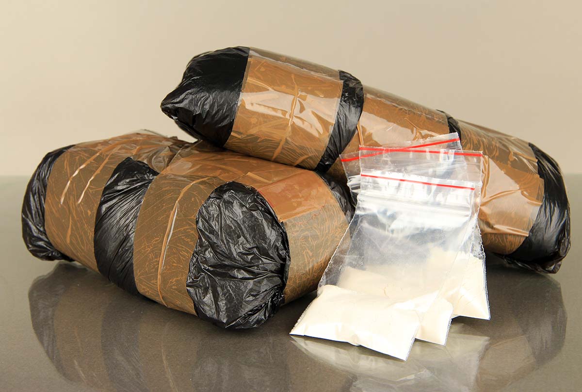 Packages,Of,Narcotics,On,Gray,Background illegal drug shipment