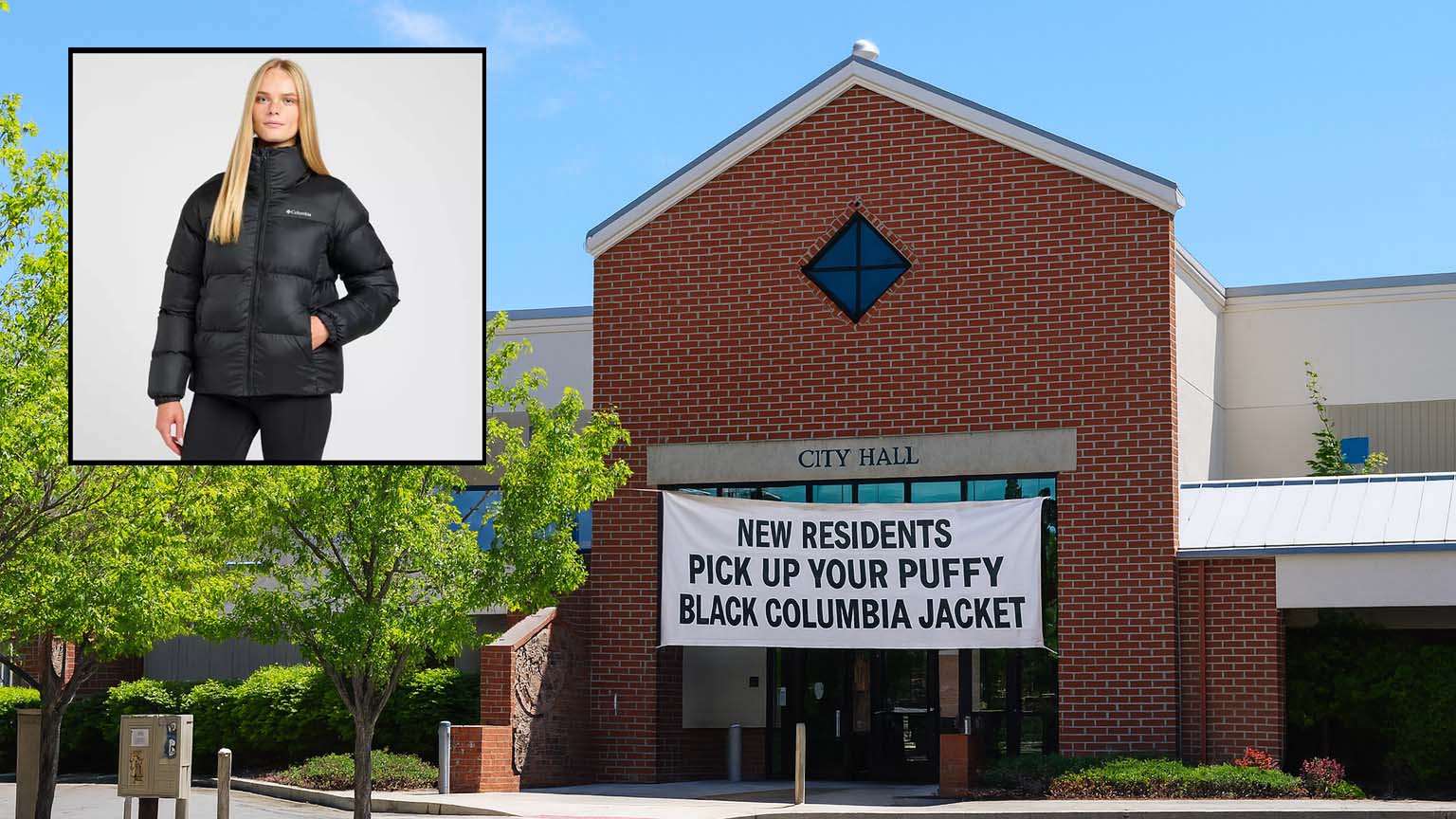 Bend_Puffy_Jacket_fb Banner hanging on Bend City Hall reading “New Residents Pick Up Your Puffy Black Columbia Jacket,” referencing a humorous satire about mandatory jackets for newcomers.