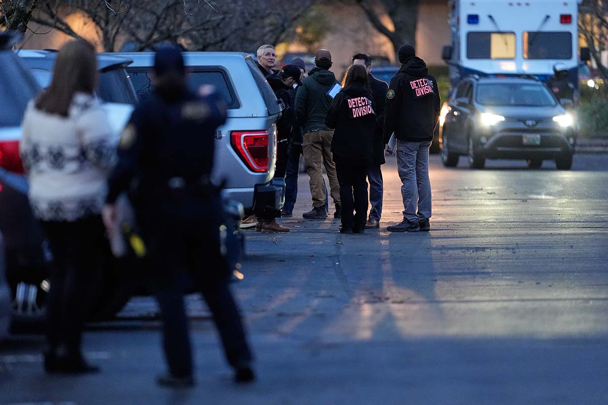 APTOPIX Immigration Enforcement Oregon Shooting Law enforcement officials work the scene Portland Oregon