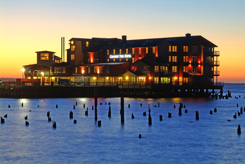 The Cannery Pier Hotel at dusk.