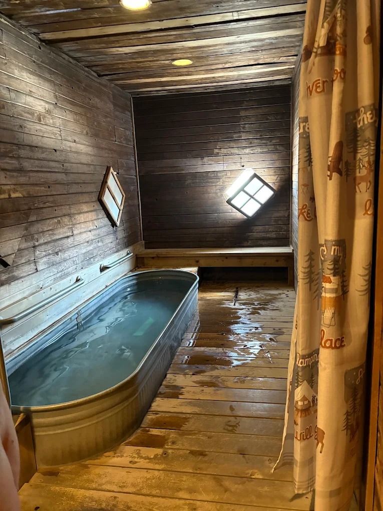 Metal soaking tub filled with mineral water at Crystal Crane Hot Springs