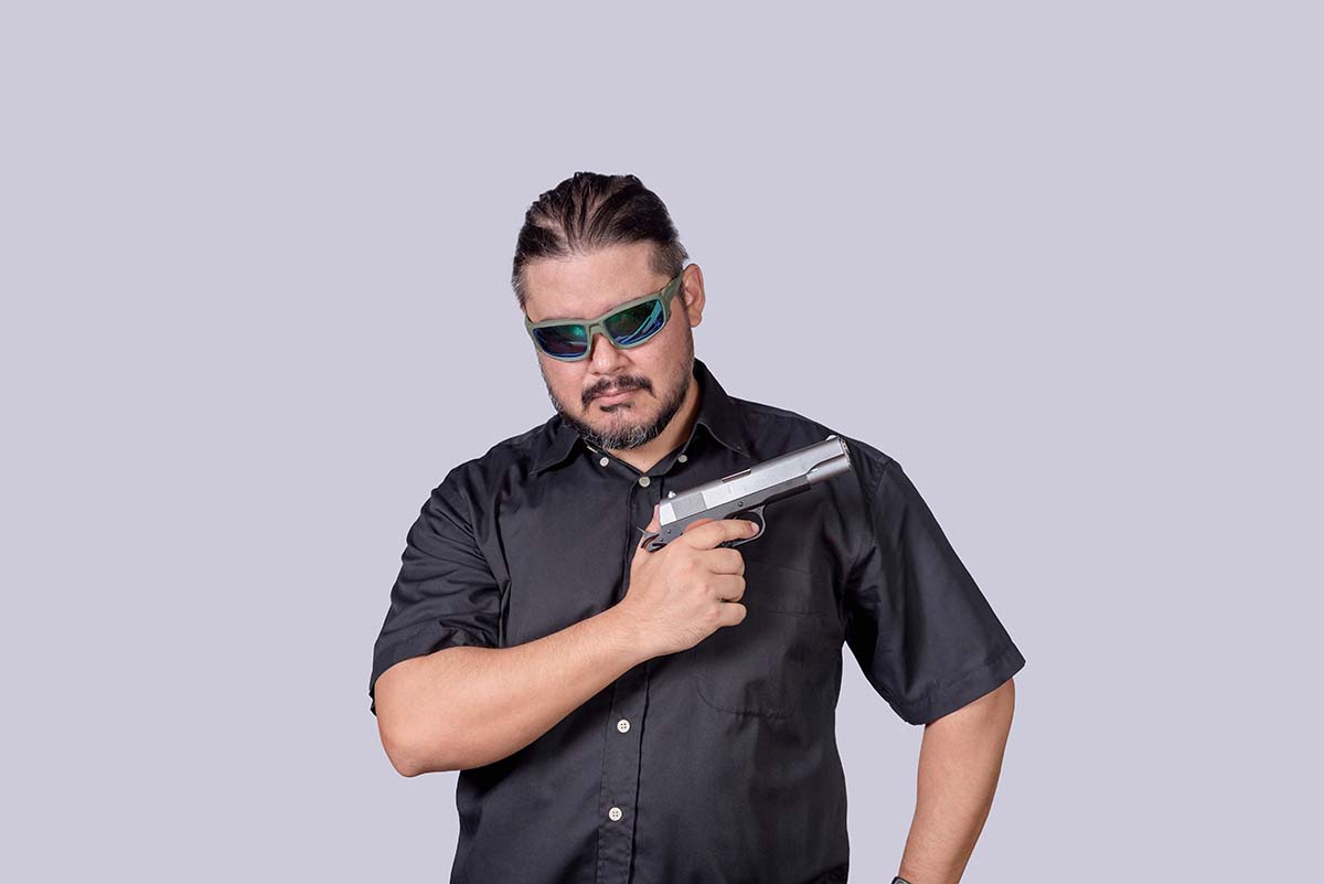 A,Ganster,Or,Henchman,Wearing,Shades,Showing,Off,His,Handgun,