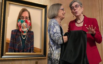 Oregon State Capitol Unveils Kate Brown Portrait In Iconic COVID Christmas Snow Globe Mask