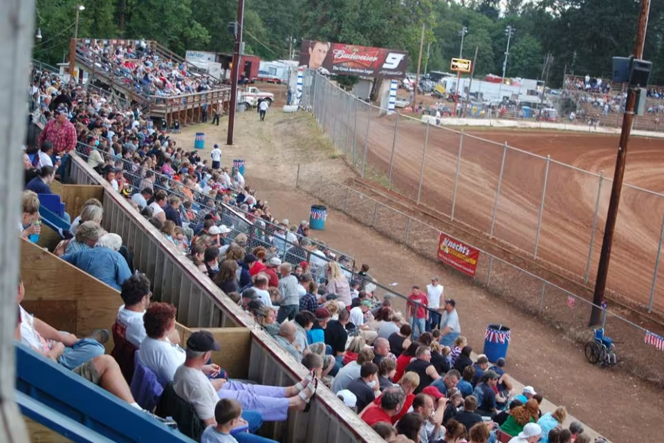 Fans watching dirt track racing at Cottage Grove Speedway in Oregon.
