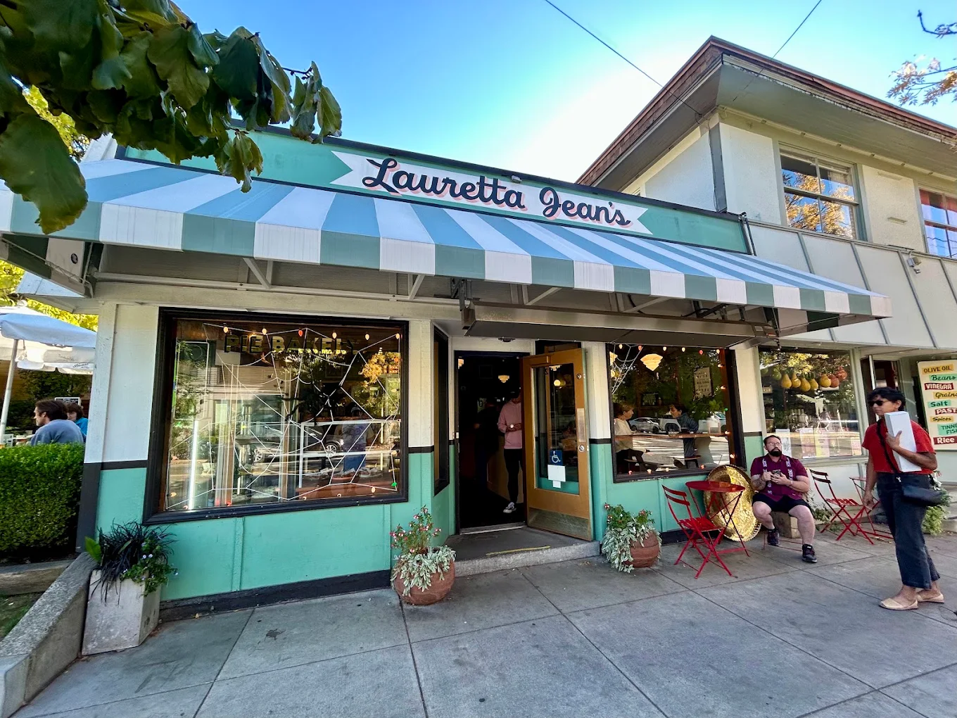 Photo by Raymond Basile via Google Local. The outside of Lauretta Jean's. It's cute light blue and has a striped blue and white awning.