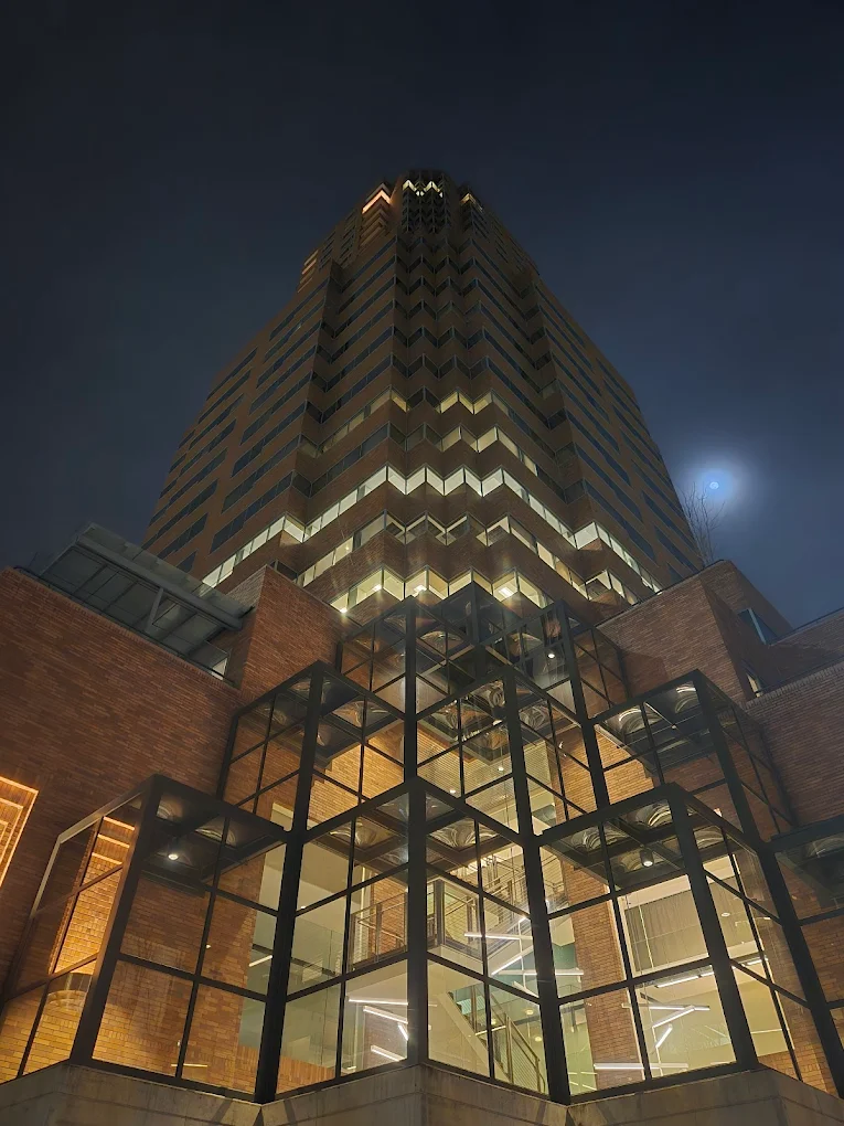 The Koin Tower in Portland lit up at night.