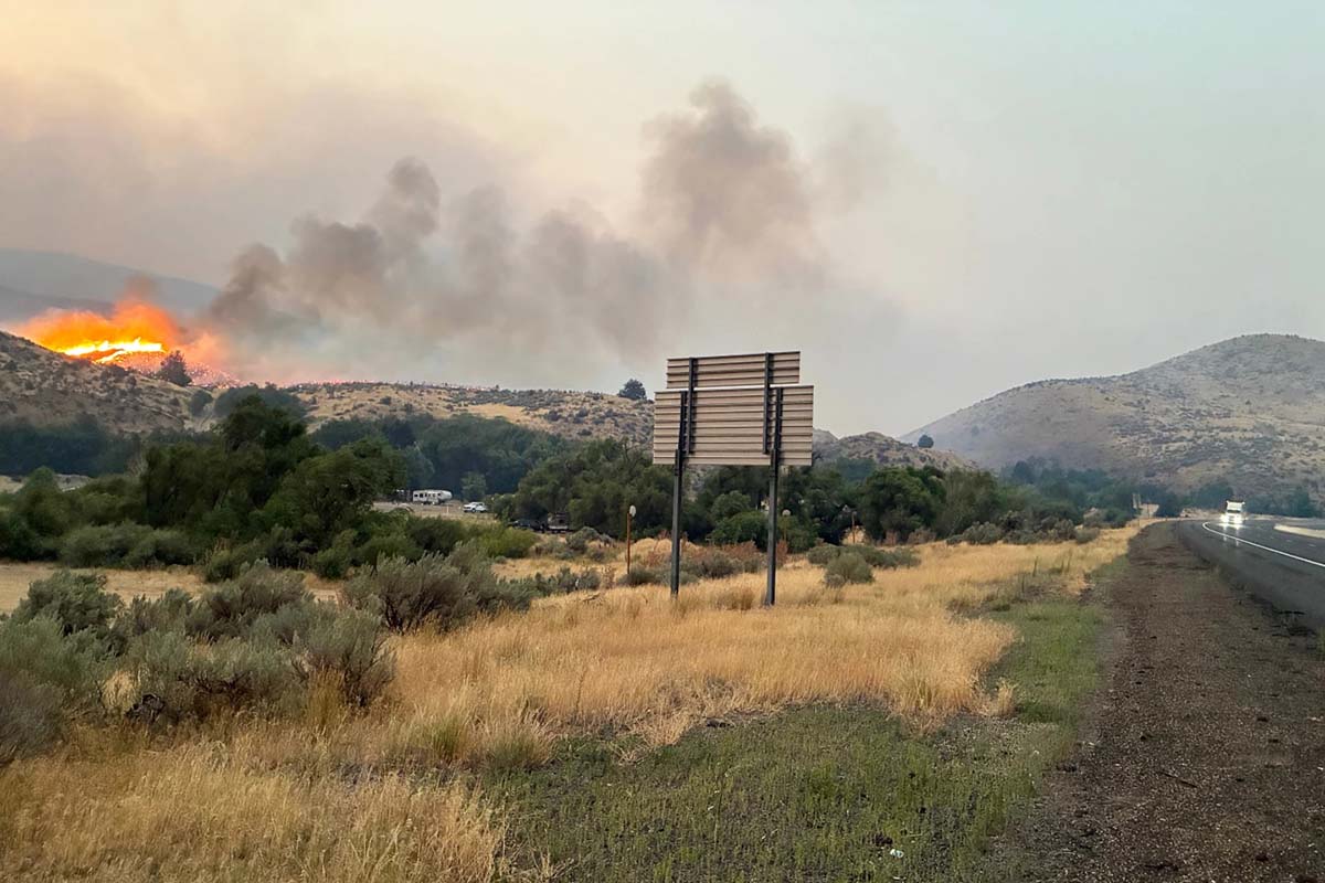 fire-oregon Dry grass and sagebrush line a highway in eastern Oregon as the Fox Fire burns nearby on July 27, 2026.