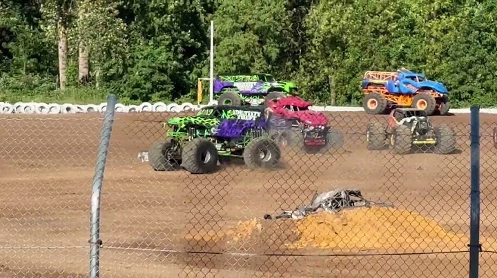 Monster trucks performing during a live event at Cottage Grove Speedway in Oregon
